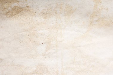 Eski kağıt çarşaf. Toz ve kirli lekelerle dolu boş bir arka plan. Eski ve antika sanat konsepti. Ayrıntılı yakın çekim stüdyo çekimi. Ön manzara. Ayarlanmış