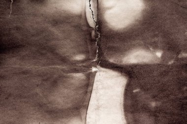 Eski kağıt çarşaf. Toz ve kirli lekelerle dolu boş bir arka plan. Eski ve antika sanat konsepti. Ayrıntılı yakın çekim stüdyo çekimi. Ön manzara. Ayarlanmış