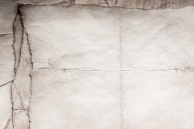 Eski kağıt çarşaf. Toz ve kirli lekelerle dolu boş bir arka plan. Eski ve antika sanat konsepti. Ayrıntılı yakın çekim stüdyo çekimi. Ön manzara. Ayarlanmış