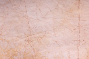 Eski kağıt çarşaf. Toz ve kirli lekelerle dolu boş bir arka plan. Eski ve antika sanat konsepti. Ayrıntılı yakın çekim stüdyo çekimi. Ön manzara. Ayarlanmış