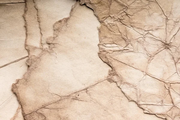 Eski kağıt çarşaf. Toz ve kirli lekelerle dolu boş bir arka plan. Eski ve antika sanat konsepti. Ayrıntılı yakın çekim stüdyo çekimi. Ön manzara. Ayarlanmış