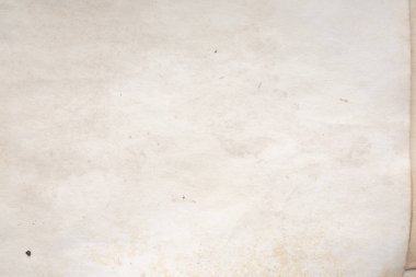 Eski kağıt çarşaf. Toz ve kirli lekelerle dolu boş bir arka plan. Eski ve antika sanat konsepti. Ayrıntılı yakın çekim stüdyo çekimi. Ön manzara. Ayarlanmış