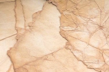 Eski kağıt çarşaf. Toz ve kirli lekelerle dolu boş bir arka plan. Eski ve antika sanat konsepti. Ayrıntılı yakın çekim stüdyo çekimi. Ön manzara. Ayarlanmış