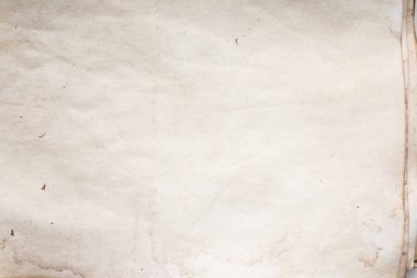 Eski kağıt çarşaf. Toz ve kirli lekelerle dolu boş bir arka plan. Eski ve antika sanat konsepti. Ayrıntılı yakın çekim stüdyo çekimi. Ön manzara. Ayarlanmış