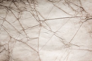 Eski kağıt çarşaf. Toz ve kirli lekelerle dolu boş bir arka plan. Eski ve antika sanat konsepti. Ayrıntılı yakın çekim stüdyo çekimi. Ön manzara. Ayarlanmış