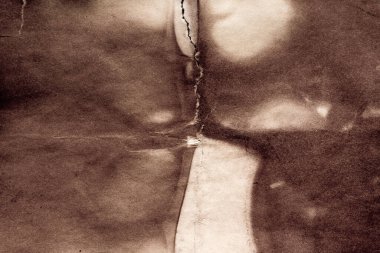 Eski kağıt çarşaf. Toz ve kirli lekelerle dolu boş bir arka plan. Eski ve antika sanat konsepti. Ayrıntılı yakın çekim stüdyo çekimi. Ön manzara. Ayarlanmış