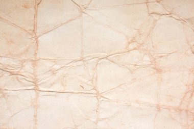 Eski kağıt çarşaf. Toz ve kirli lekelerle dolu boş bir arka plan. Eski ve antika sanat konsepti. Ayrıntılı yakın çekim stüdyo çekimi. Ön manzara. Ayarlanmış