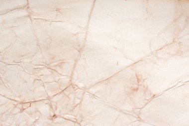 Eski kağıt çarşaf. Toz ve kirli lekelerle dolu boş bir arka plan. Eski ve antika sanat konsepti. Ayrıntılı yakın çekim stüdyo çekimi. Ön manzara. Ayarlanmış