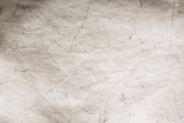 Eski kağıt çarşaf. Toz ve kirli lekelerle dolu boş bir arka plan. Eski ve antika sanat konsepti. Ayrıntılı yakın çekim stüdyo çekimi. Ön manzara. Ayarlanmış