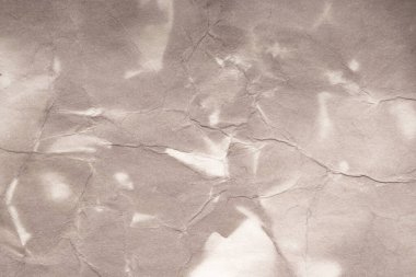 Eski kağıt çarşaf. Toz ve kirli lekelerle dolu boş bir arka plan. Eski ve antika sanat konsepti. Ayrıntılı yakın çekim stüdyo çekimi. Ön manzara. Ayarlanmış