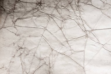 Eski kağıt çarşaf. Toz ve kirli lekelerle dolu boş bir arka plan. Eski ve antika sanat konsepti. Ayrıntılı yakın çekim stüdyo çekimi. Ön manzara. Ayarlanmış