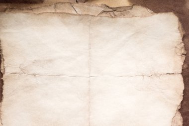 Eski kağıt çarşaf. Toz ve kirli lekelerle dolu boş bir arka plan. Eski ve antika sanat konsepti. Ayrıntılı yakın çekim stüdyo çekimi. Ön manzara. Ayarlanmış