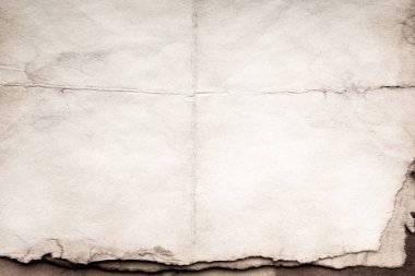 Eski kağıt çarşaf. Toz ve kirli lekelerle dolu boş bir arka plan. Eski ve antika sanat konsepti. Ayrıntılı yakın çekim stüdyo çekimi. Ön manzara. Ayarlanmış