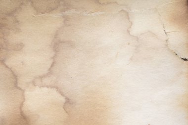 Eski kağıt çarşaf. Toz ve kirli lekelerle dolu boş bir arka plan. Eski ve antika sanat konsepti. Ayrıntılı yakın çekim stüdyo çekimi. Ön manzara. Ayarlanmış