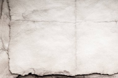 Eski kağıt çarşaf. Toz ve kirli lekelerle dolu boş bir arka plan. Eski ve antika sanat konsepti. Ayrıntılı yakın çekim stüdyo çekimi. Ön manzara. Ayarlanmış
