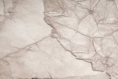 Eski kağıt çarşaf. Toz ve kirli lekelerle dolu boş bir arka plan. Eski ve antika sanat konsepti. Ayrıntılı yakın çekim stüdyo çekimi. Ön manzara. Ayarlanmış