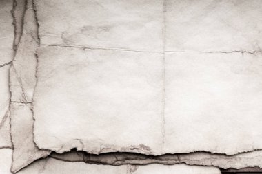 Eski kağıt çarşaf. Toz ve kirli lekelerle dolu boş bir arka plan. Eski ve antika sanat konsepti. Ayrıntılı yakın çekim stüdyo çekimi. Ön manzara. Ayarlanmış