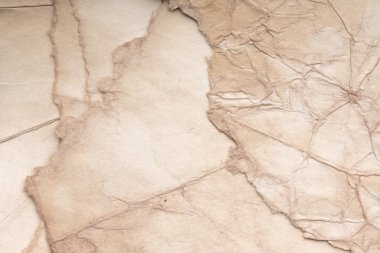 Eski kağıt çarşaf. Toz ve kirli lekelerle dolu boş bir arka plan. Eski ve antika sanat konsepti. Ayrıntılı yakın çekim stüdyo çekimi. Ön manzara. Ayarlanmış