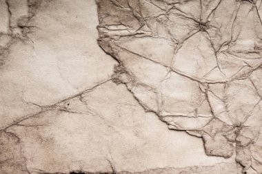 Eski kağıt çarşaf. Toz ve kirli lekelerle dolu boş bir arka plan. Eski ve antika sanat konsepti. Ayrıntılı yakın çekim stüdyo çekimi. Ön manzara. Ayarlanmış