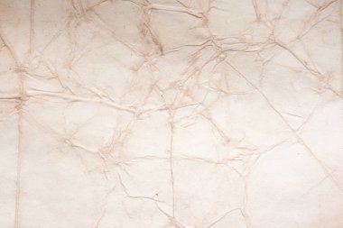 Eski kağıt çarşaf. Toz ve kirli lekelerle dolu boş bir arka plan. Eski ve antika sanat konsepti. Ayrıntılı yakın çekim stüdyo çekimi. Ön manzara. Ayarlanmış