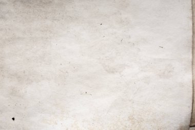 Eski kağıt çarşaf. Toz ve kirli lekelerle dolu boş bir arka plan. Eski ve antika sanat konsepti. Ayrıntılı yakın çekim stüdyo çekimi. Ön manzara. Ayarlanmış
