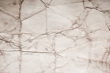 Eski kağıt çarşaf. Toz ve kirli lekelerle dolu boş bir arka plan. Eski ve antika sanat konsepti. Ayrıntılı yakın çekim stüdyo çekimi. Ön manzara. Ayarlanmış