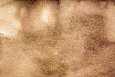 Eski kağıt çarşaf. Toz ve kirli lekelerle dolu boş bir arka plan. Eski ve antika sanat konsepti. Ayrıntılı yakın çekim stüdyo çekimi. Ön manzara. Ayarlanmış