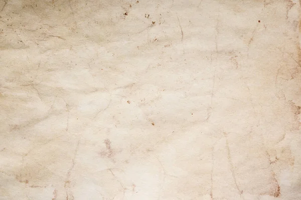 Eski kağıt çarşaf. Toz ve kirli lekelerle dolu boş bir arka plan. Eski ve antika sanat konsepti. Ayrıntılı yakın çekim stüdyo çekimi. Ön manzara. Ayarlanmış