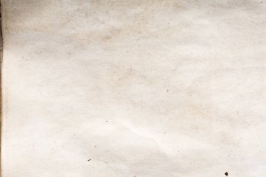 Eski kağıt çarşaf. Toz ve kirli lekelerle dolu boş bir arka plan. Eski ve antika sanat konsepti. Ayrıntılı yakın çekim stüdyo çekimi. Ön manzara. Ayarlanmış