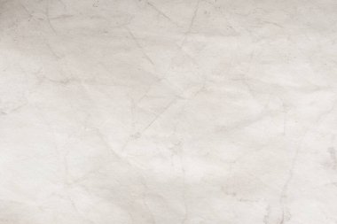 Eski kağıt çarşaf. Toz ve kirli lekelerle dolu boş bir arka plan. Eski ve antika sanat konsepti. Ayrıntılı yakın çekim stüdyo çekimi. Ön manzara. Ayarlanmış
