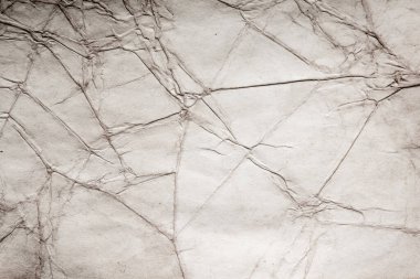 Eski kağıt çarşaf. Toz ve kirli lekelerle dolu boş bir arka plan. Eski ve antika sanat konsepti. Ayrıntılı yakın çekim stüdyo çekimi. Ön manzara. Ayarlanmış