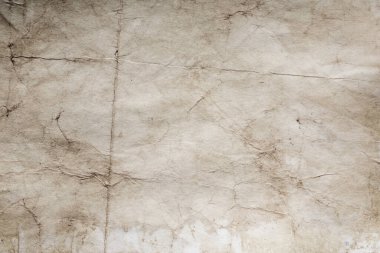 Eski kağıt çarşaf. Toz ve kirli lekelerle dolu boş bir arka plan. Eski ve antika sanat konsepti. Ayrıntılı yakın çekim stüdyo çekimi. Ön manzara. Ayarlanmış