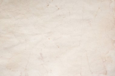 Eski kağıt çarşaf. Toz ve kirli lekelerle dolu boş bir arka plan. Eski ve antika sanat konsepti. Ayrıntılı yakın çekim stüdyo çekimi. Ön manzara. Ayarlanmış