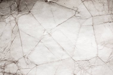 Eski kağıt çarşaf. Toz ve kirli lekelerle dolu boş bir arka plan. Eski ve antika sanat konsepti. Ayrıntılı yakın çekim stüdyo çekimi. Ön manzara. Ayarlanmış