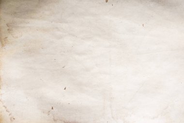 Eski kağıt çarşaf. Toz ve kirli lekelerle dolu boş bir arka plan. Eski ve antika sanat konsepti. Ayrıntılı yakın çekim stüdyo çekimi. Ön manzara. Ayarlanmış