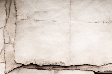 Eski kağıt çarşaf. Toz ve kirli lekelerle dolu boş bir arka plan. Eski ve antika sanat konsepti. Ayrıntılı yakın çekim stüdyo çekimi. Ön manzara. Ayarlanmış