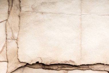 Eski kağıt çarşaf. Toz ve kirli lekelerle dolu boş bir arka plan. Eski ve antika sanat konsepti. Ayrıntılı yakın çekim stüdyo çekimi. Ön manzara. Ayarlanmış