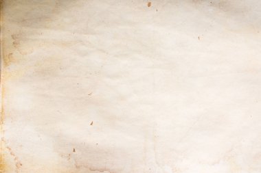 Eski kağıt çarşaf. Toz ve kirli lekelerle dolu boş bir arka plan. Eski ve antika sanat konsepti. Ayrıntılı yakın çekim stüdyo çekimi. Ön manzara. Ayarlanmış