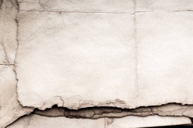 Eski kağıt çarşaf. Toz ve kirli lekelerle dolu boş bir arka plan. Eski ve antika sanat konsepti. Ayrıntılı yakın çekim stüdyo çekimi. Ön manzara. Ayarlanmış