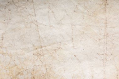 Eski kağıt çarşaf. Toz ve kirli lekelerle dolu boş bir arka plan. Eski ve antika sanat konsepti. Ayrıntılı yakın çekim stüdyo çekimi. Ön manzara. Ayarlanmış