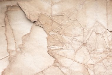 Eski kağıt çarşaf. Toz ve kirli lekelerle dolu boş bir arka plan. Eski ve antika sanat konsepti. Ayrıntılı yakın çekim stüdyo çekimi. Ön manzara. Ayarlanmış