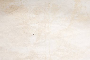 Eski kağıt çarşaf. Toz ve kirli lekelerle dolu boş bir arka plan. Eski ve antika sanat konsepti. Ayrıntılı yakın çekim stüdyo çekimi. Ön manzara. Ayarlanmış