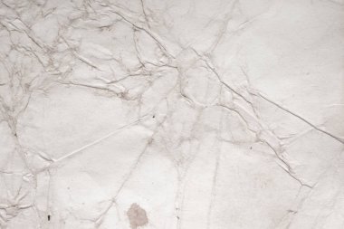 Eski kağıt çarşaf. Toz ve kirli lekelerle dolu boş bir arka plan. Eski ve antika sanat konsepti. Ayrıntılı yakın çekim stüdyo çekimi. Ön manzara. Ayarlanmış