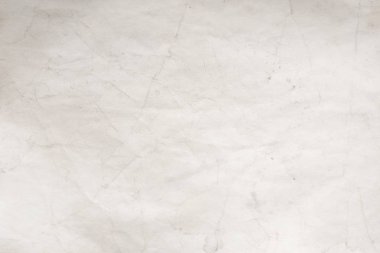 Eski kağıt çarşaf. Toz ve kirli lekelerle dolu boş bir arka plan. Eski ve antika sanat konsepti. Ayrıntılı yakın çekim stüdyo çekimi. Ön manzara. Ayarlanmış