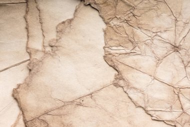 Eski kağıt çarşaf. Toz ve kirli lekelerle dolu boş bir arka plan. Eski ve antika sanat konsepti. Ayrıntılı yakın çekim stüdyo çekimi. Ön manzara. Ayarlanmış