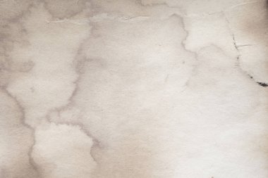 Eski kağıt çarşaf. Toz ve kirli lekelerle dolu boş bir arka plan. Eski ve antika sanat konsepti. Ayrıntılı yakın çekim stüdyo çekimi. Ön manzara. Ayarlanmış