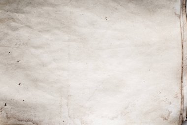 Eski kağıt çarşaf. Toz ve kirli lekelerle dolu boş bir arka plan. Eski ve antika sanat konsepti. Ayrıntılı yakın çekim stüdyo çekimi. Ön manzara. Ayarlanmış