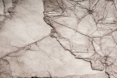 Eski kağıt çarşaf. Toz ve kirli lekelerle dolu boş bir arka plan. Eski ve antika sanat konsepti. Ayrıntılı yakın çekim stüdyo çekimi. Ön manzara. Ayarlanmış