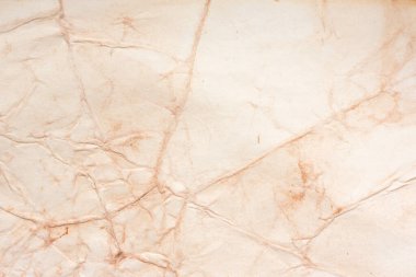 Eski kağıt çarşaf. Toz ve kirli lekelerle dolu boş bir arka plan. Eski ve antika sanat konsepti. Ayrıntılı yakın çekim stüdyo çekimi. Ön manzara. Ayarlanmış