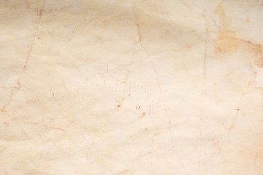 Eski kağıt çarşaf. Toz ve kirli lekelerle dolu boş bir arka plan. Eski ve antika sanat konsepti. Ayrıntılı yakın çekim stüdyo çekimi. Ön manzara. Ayarlanmış